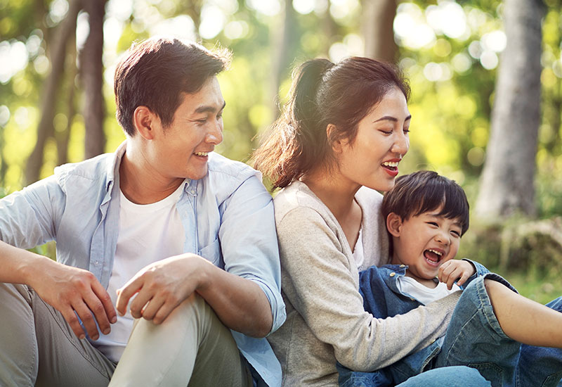 Image of family together in the park