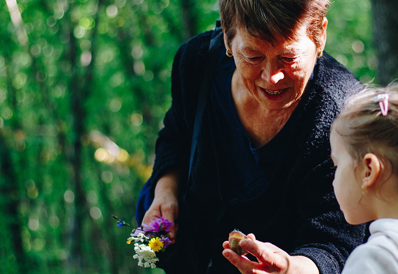 grandmother with grand children in the forrest