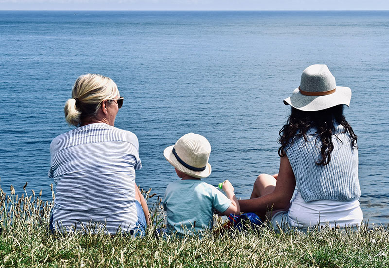 family sitting having a picnic